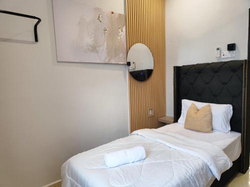 Postel nebo postele na pokoji v ubytování Rentio Homestay