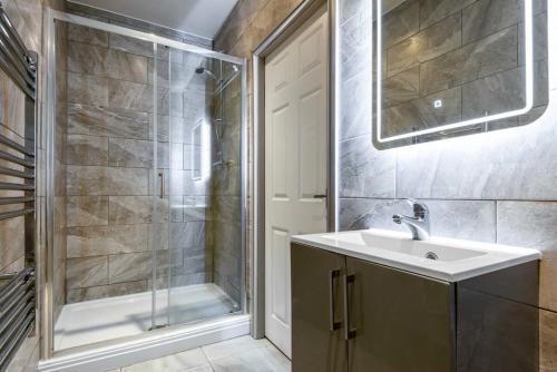 a bathroom with a sink and a shower at Contemporary 1 Bed Budget Apartment in Darlington in Darlington