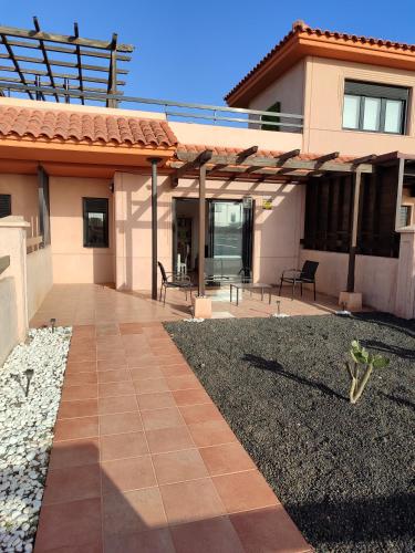a patio of a house with a patio at Villa Punta Calma in Majanicho