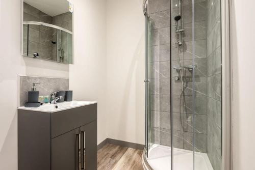 a bathroom with a shower and a sink at 1 Bedroom Budget Apartment in Central Doncaster in Doncaster