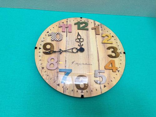 a wooden clock is hanging on a wall at 忍野八海まで車で４分！ワンランク上のアウトドアライフ堪能できる【LongevityVillage】A in Minamitsuru