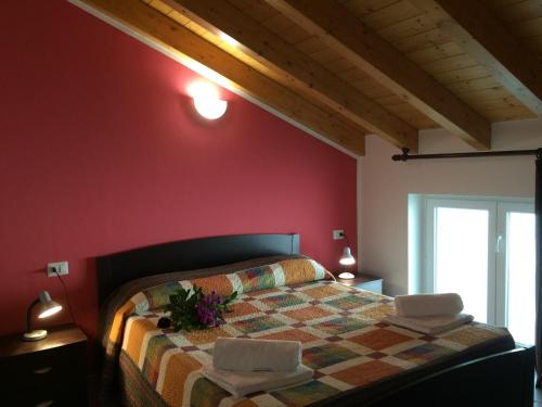 Een bed of bedden in een kamer bij Residence Le Azalee & SPA