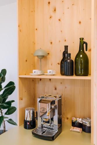 a kitchen with a espresso machine on a counter at SCHILCHERLANDLEBEN - Hochgrail in Greisdorf