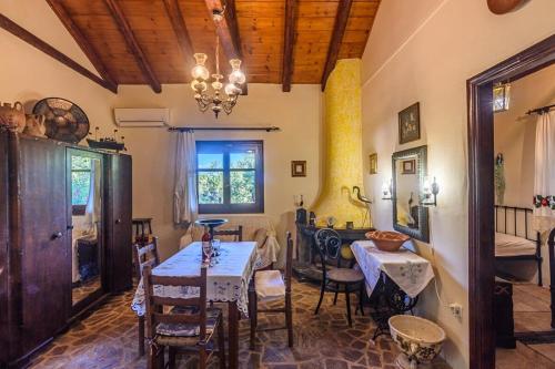 a dining room with a table and chairs at The Fairytale House Seaside Retreat in Chrani
