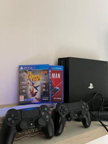 two nintendo wii game controllers and a box at Beach Studio Durrës in Durrës