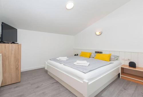 Katil atau katil-katil dalam bilik di Apartments Antic