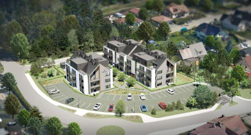an aerial view of a large house with cars on the driveway at Baltic Line Marina-Mewa in Gdańsk