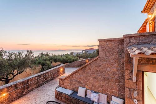 a view from the balcony of a house at Mani Panoramic Views - Private Sunny Retreat in Levktron