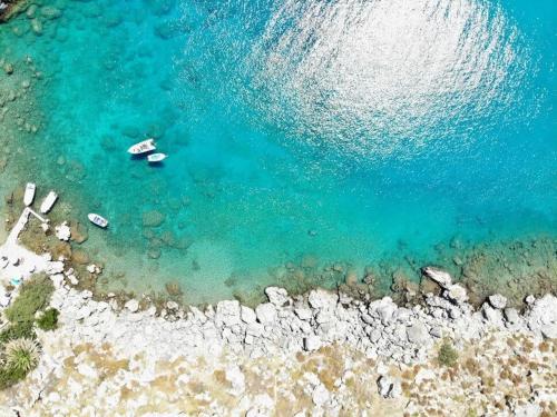 an aerial view of a beach with boats in the water at Atlantic Cave Haven-Seaside, Fully Equipped in Kolymbia