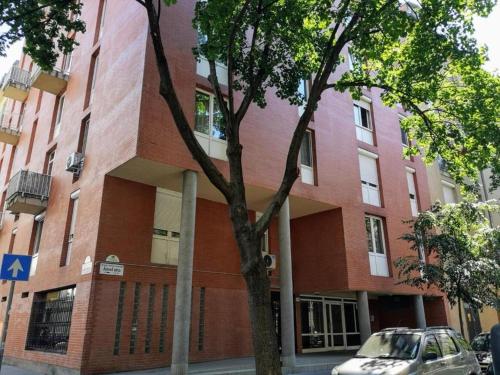 a building with a car parked in front of it at Dream Destination Apartment in Budapest