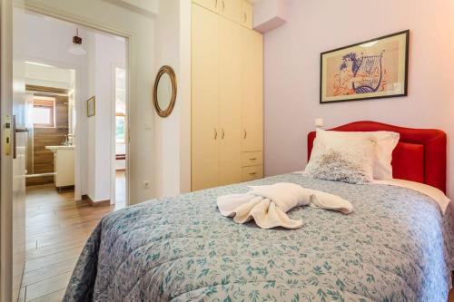 a bedroom with a bed with a towel on it at Stemnitsa Stone Residence - Cosy Mountain Escape in Stemnitsa