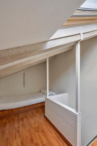 Una cama o camas en una habitación de Hotel de l'Isard