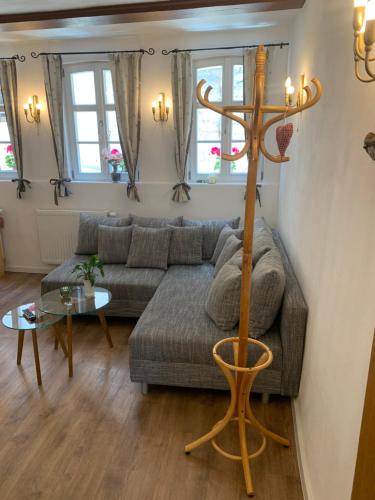 a living room with a couch and a table at Gästehaus am Plönlein in Rothenburg ob der Tauber