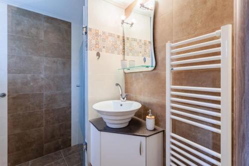 a bathroom with a sink and a shower at Arcadia Getaway - Levidi Sani 11 Studio in Levidi