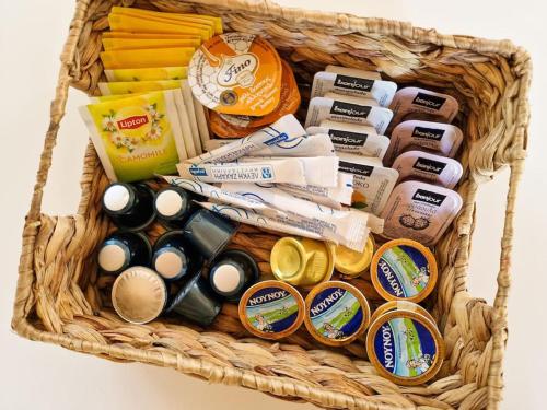 a basket filled with different types of food at Cozy Owl's Studio Home in Pýrgos