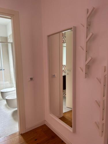 a bathroom with a mirror on the wall at Casa Elogi in Buti