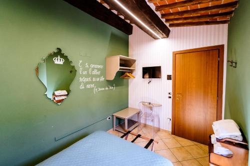 Ένα ή περισσότερα κρεβάτια σε δωμάτιο στο B&B Da Nada Locanda Toscana
