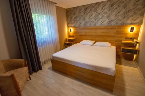 Green Palace Suite Hotelにあるベッド