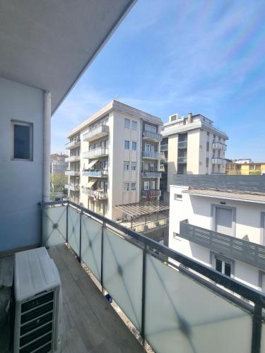 a balcony with a bench on a building at Due Gemelle in Rimini
