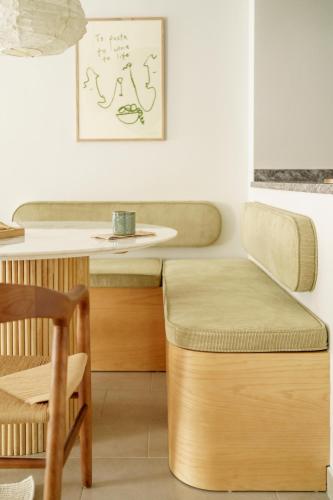 a table and a stool in a room with a sink at Racons - La Placeta "cyclingfriendly" in Vic