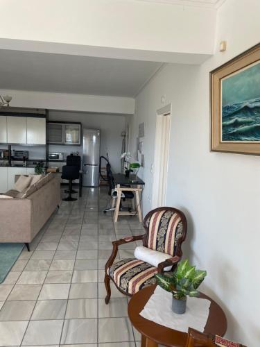 a living room with a couch and a table at Eagles Nest Villa Athenian Riviera in Aghia Marina near Lagonisi, next to the beach close to Athens Airport in Aghia Marina