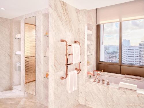 a bathroom with a shower and a sink at Royal Mansour Casablanca in Casablanca