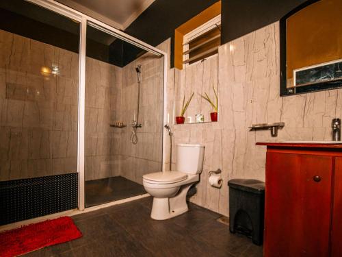 a bathroom with a toilet and a shower at The Panorama Negombo in Negombo