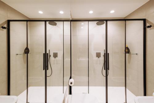 a shower with glass doors in a bathroom at Marisabella Suite Spa 3 in Bari