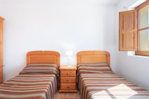 Postel nebo postele na pokoji v ubytování Casa del Practicant
