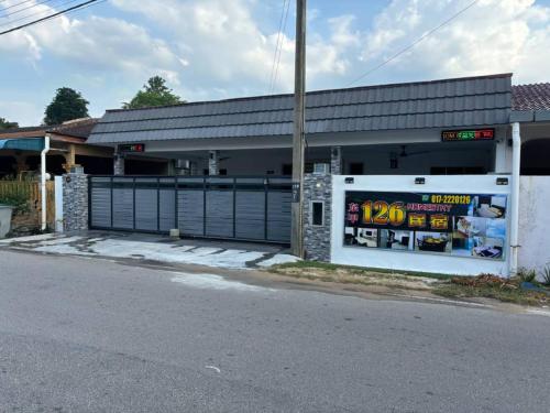 a gas station on the side of a street at 126 Homestay TYPE B in Tangkak