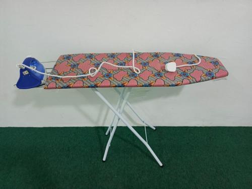 a table with a surfboard on top of it at HASD GUESTHOUSE in Kampong Tebing Rabak
