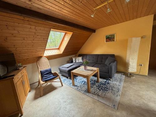 a living room with a couch and a table at Ferienhof Bohg in Burg