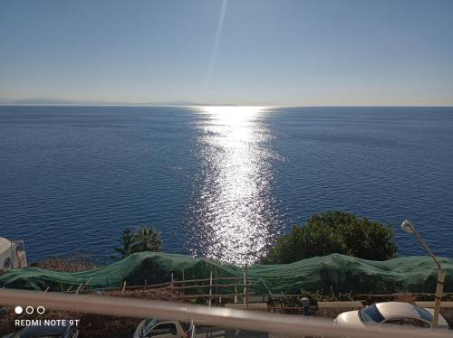 a view of the ocean with a green tarp at Turchese in Amalfi