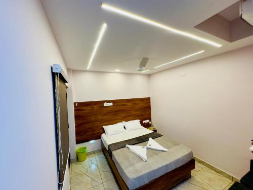 Ένα ή περισσότερα κρεβάτια σε δωμάτιο στο GREENS INN near Madras High Court and Harbour Chennai Port