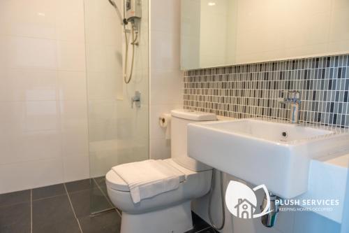 a bathroom with a toilet and a sink at Highpark Suites at Petaling Jaya, Kelana Jaya by Plush in Petaling Jaya