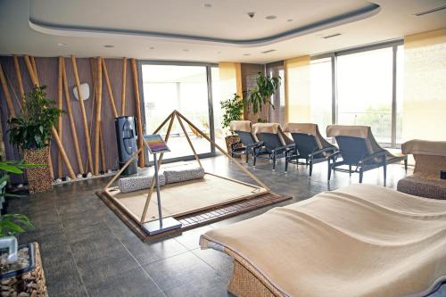 a waiting room with chairs and a mirror at Hotel Ponteo - Activity Park in Bratislava