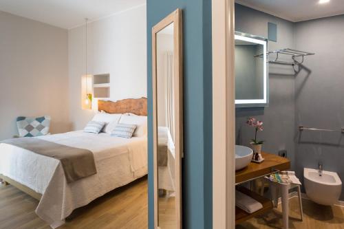 Una cama o camas en una habitación de Bellaroto Suite & SPA