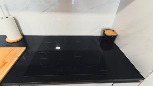 a black stove top oven sitting in a kitchen at GuestReady - Glamorous getaway in Coimbra in Coimbra