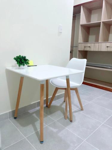 a white table and a white chair in a kitchen at Sunset Home 2B (Gated) in Higuey
