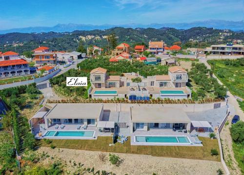 an aerial view of a house with a swimming pool at Lefkimmiatis Villas Corfu in Afionas