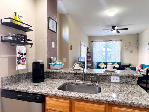 a kitchen with a sink and a counter top at Sunshine Retreat 4 Bed Town Home-4017VBD in Kissimmee