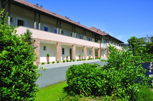 a building with a road in front of it at apartmentHAUSmannstätten in Hausmannstätten