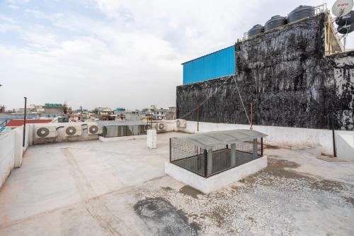 a bench on the roof of a building at Homlee-Vasundhara 3BHK Flat- kitchen-Parking-Lift in Ghaziabad