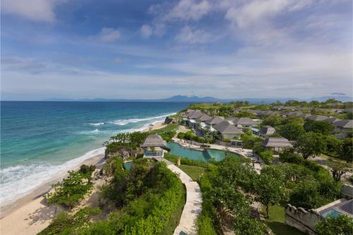 an aerial view of a resort on the beach at Jumeirah Bali in Uluwatu