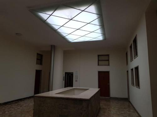 an empty room with a skylight on the ceiling at IRIS Bilocale Centro Città in Busto Arsizio