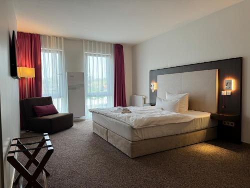 Postel nebo postele na pokoji v ubytování Fontane Hotel