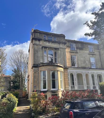 an old house with a car parked in front of it at Hillside in Bristol