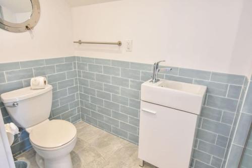 a bathroom with a toilet and a sink at East End Condo w Beach Access in Provincetown