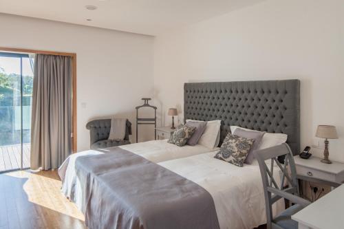 Un pat sau paturi într-o cameră la Quinta do Fontelo