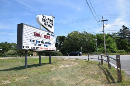 a sign for a gas station on the side of a road at Marsh Front Home w Sweeping Views in Wellfleet